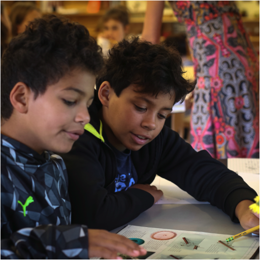 two children with book