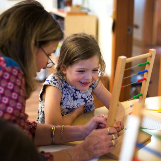 Child and guide with abacus
