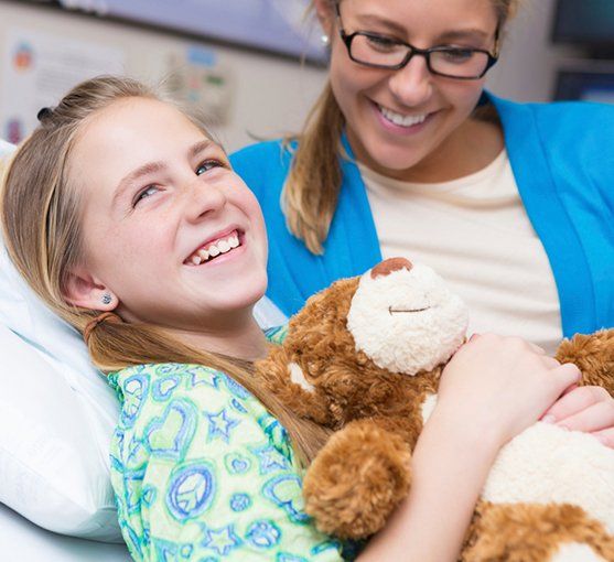 kid with teddy bear