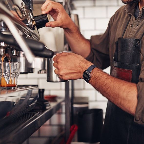 Barista Using a Coffee Maker — Cadillac, MI — All Beans Coffee Company Barista Using a Coffee Maker — Cadillac, MI — All Beans Coffee Company