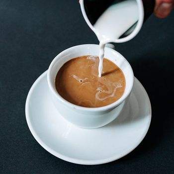 Creamer Being Poured Into the Cup — Cadillac, MI — All Beans Coffee Company