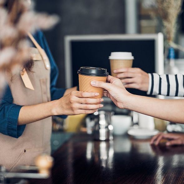 Barista Served the Hot Coffee to Customer — Cadillac, MI — All Beans Coffee Company