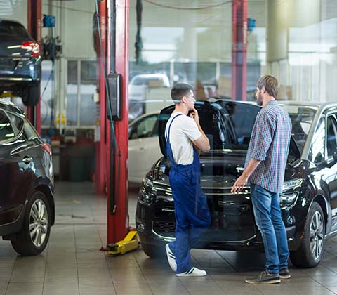 Mechanic Talking with the Car Owner — Redmond, WA — Redmond Werkshop Inc Mechanic Talking with the Car Owner — Redmond, WA — Redmond Werkshop Inc