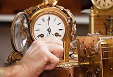 New Clocks — Man Winding Clock Hands in Wayland, MA New Clocks — Man Winding Clock Hands in Wayland, MA