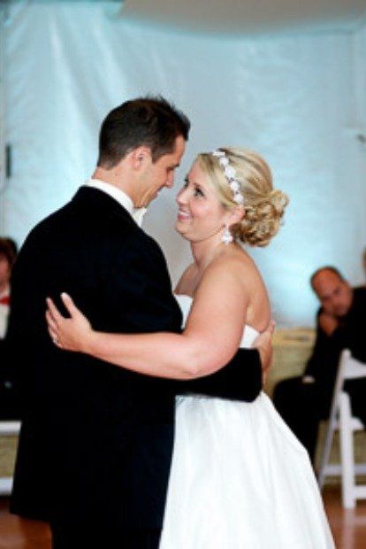 Happy Couple Dancing At Their Wedding