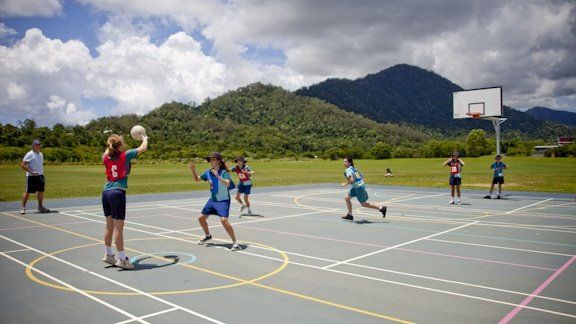Source: Giles-Corti B, et al. Increasing walking: How important is distance to, attractiveness, and size of public open space? American Journal of Preventive Medicine. 2005;28(2, Supplement 2):169-76. A group of people are playing basketball on a court with mountains in the background.