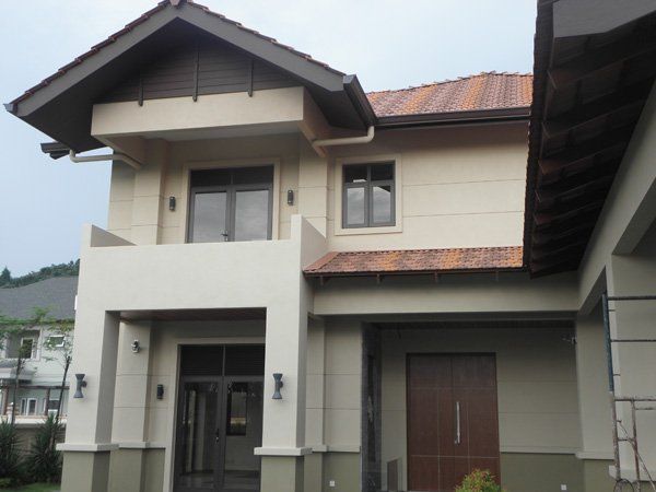 A large white house with a brown roof