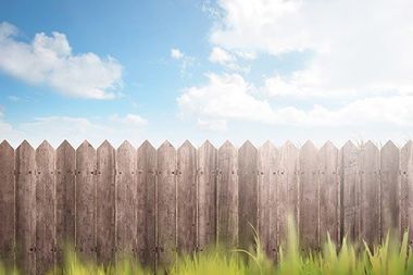 Wooden Fence on a Green Garden — Atlanta, GA — West Georgia Fence Co Wooden Fence on a Green Garden — Atlanta, GA — West Georgia Fence Co