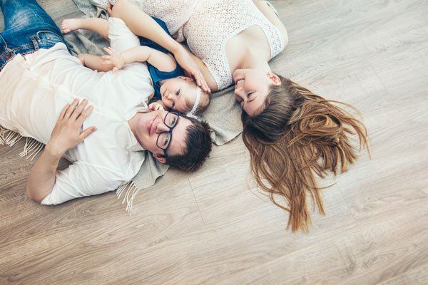 happy family on new wood floors