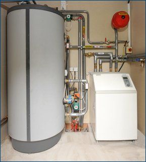 For servicing or repairing a broken boiler in Portsmouth, Hampshire call 07887 623 079 Large grey boiler in a room
