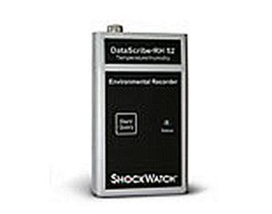 A shock recorder is sitting on a white surface.