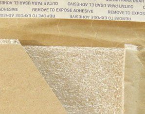A piece of paper that says remove to expose adhesive on it