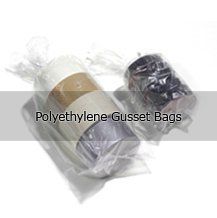 A couple of plastic bags sitting next to each other on a table.