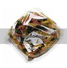 A bag of mixed spiral pasta in a clear plastic bag.
