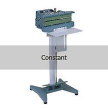 A machine is sitting on top of a stand on a table.