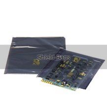 A motherboard is sitting on top of a shield bag.