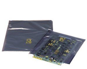 A motherboard is sitting on top of a plastic bag.