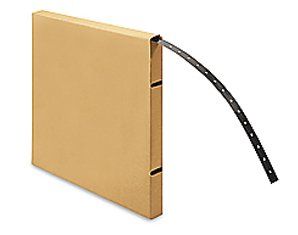 A cardboard box with a roll of black tape in it.