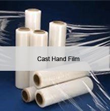 Rolls of plastic wrap are stacked on top of each other on a table.