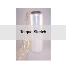 A roll of torque stretch plastic wrap is sitting on a table.