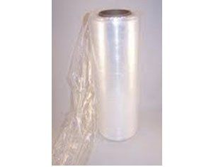 A roll of clear plastic wrap is sitting on a table.