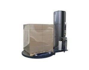 A machine is wrapping a pallet of boxes on a white background.