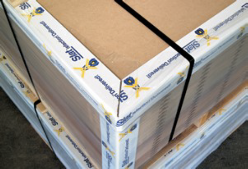 A stack of cardboard boxes are wrapped with a sticker that says 