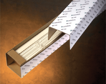 A cardboard box with a white piece of paper in it