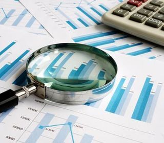 Business Tax Prep — A Magnifying Glass With Some Documents Behind In Baton Rouge, LA Business Tax Prep — A Magnifying Glass With Some Documents Behind In Baton Rouge, LA