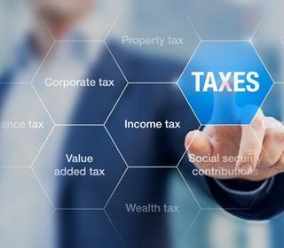 Business Tax Preparation — A Man Pointing To A Taxes Category In Baton Rouge, LA Business Tax Preparation — A Man Pointing To A Taxes Category In Baton Rouge, LA