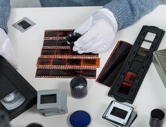 Examining film negatives, slides, and analog media.