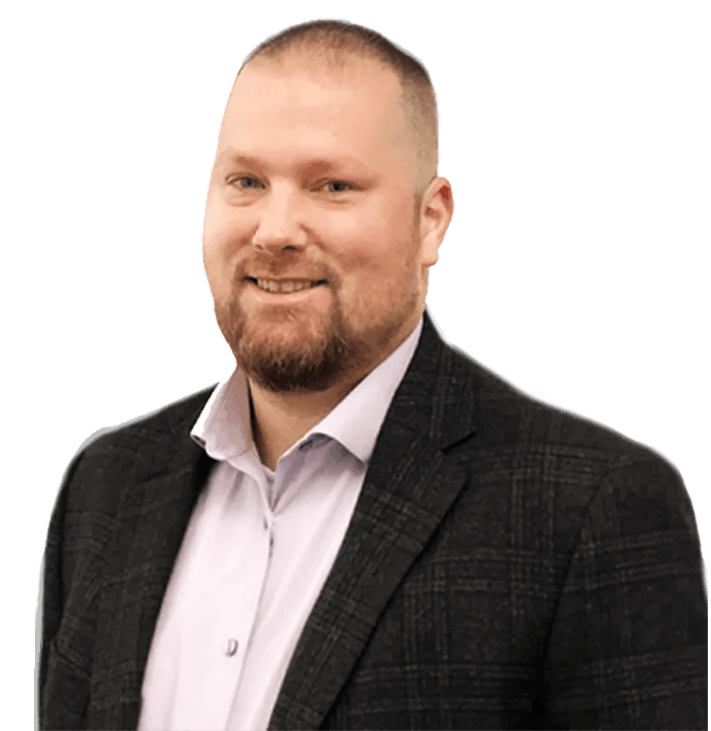 Smiling man in a dark plaid blazer and light shirt against a white background