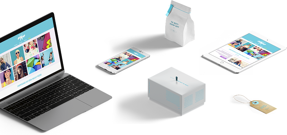 A laptop , tablet , phone , and box are sitting on a table.