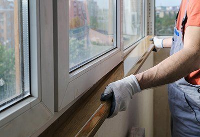 Window Design — Man Repairing Window in Augusta, GA