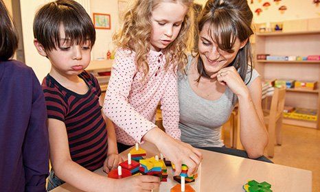 children playing with teacher