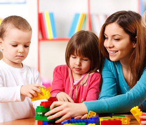 children playing building blocks