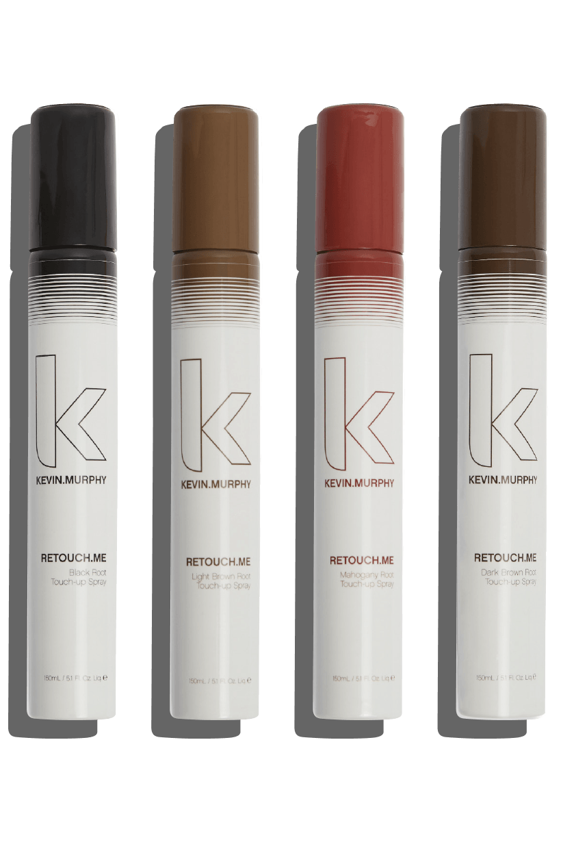 Four tubes of hair tint in black, brown, auburn, and light brown, standing on white.