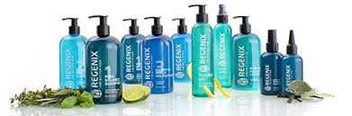Various blue Regenix hair products displayed on a white background with herbs and a lime slice.