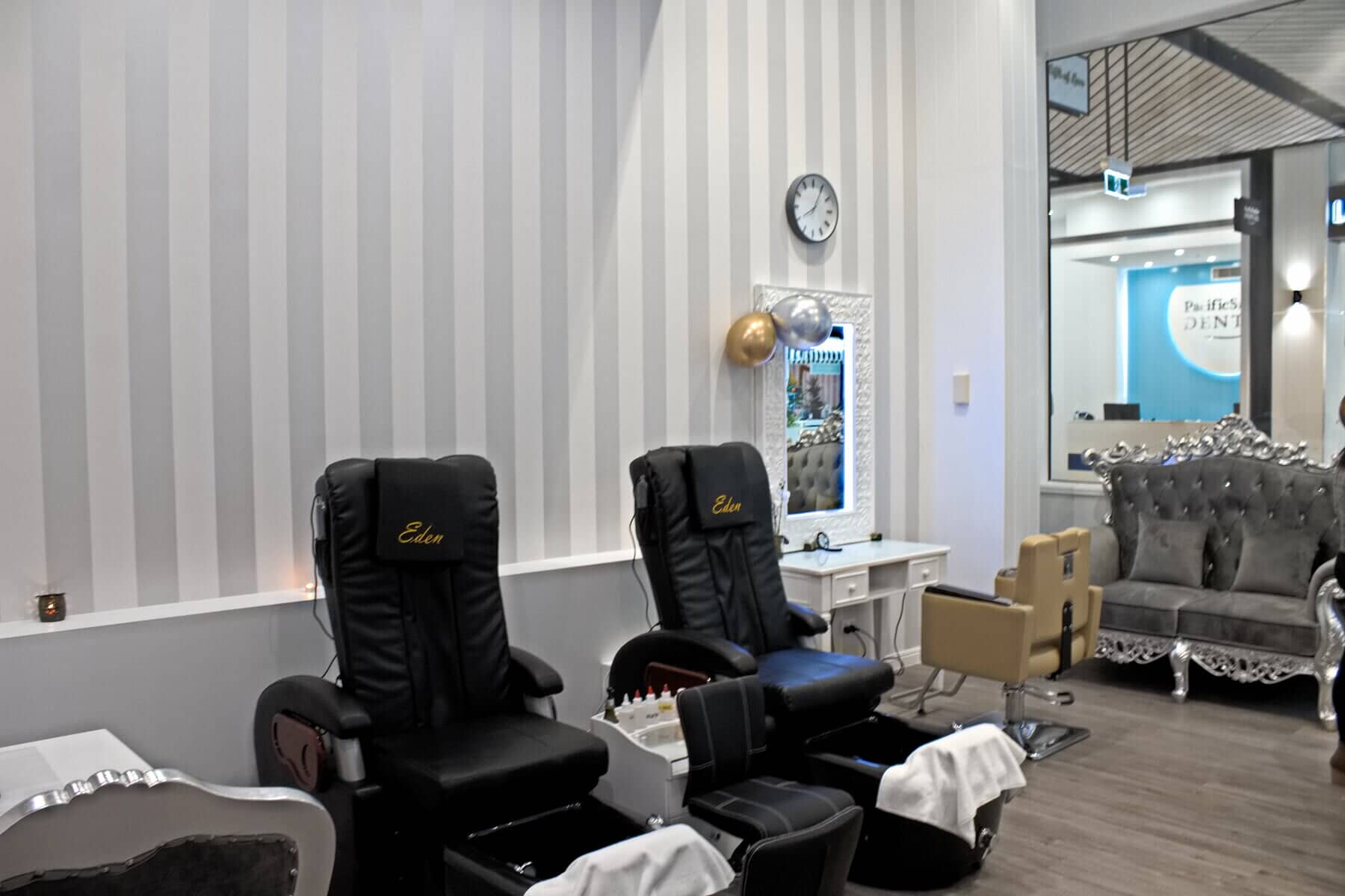 A salon with a lot of chairs and a couch.