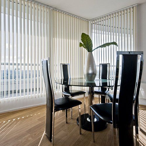 White Vertical Blinds in Apartment Dining Room — Lewisville, TX — Installation-Nation White Vertical Blinds in Apartment Dining Room — Lewisville, TX — Installation-Nation