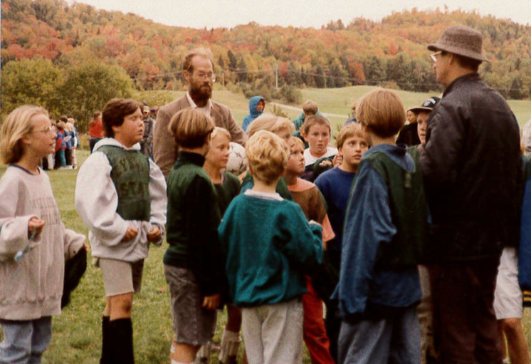 Old photo of teachers and students outside at the Riverside School