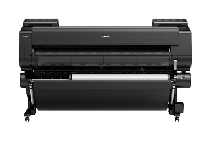 Canon large-format inkjet printer, black, with roll of paper loaded and ready to print.