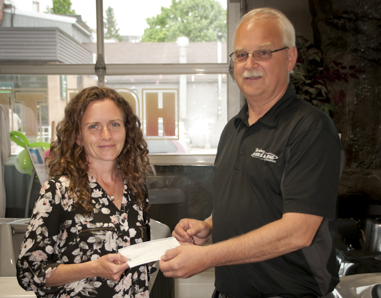 Preston Owen presenting donation cheque