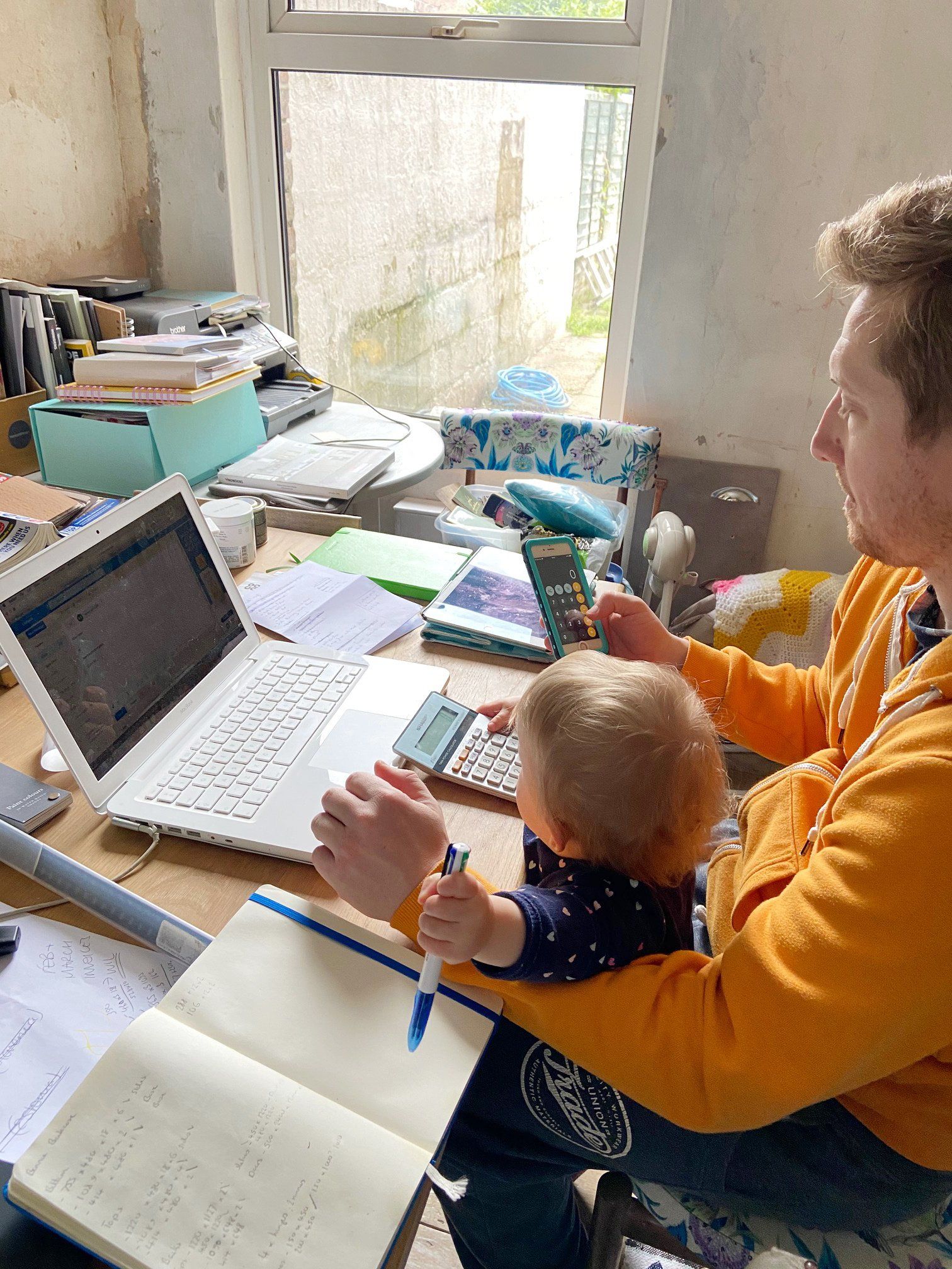 Kier and Aurora working at a laptop