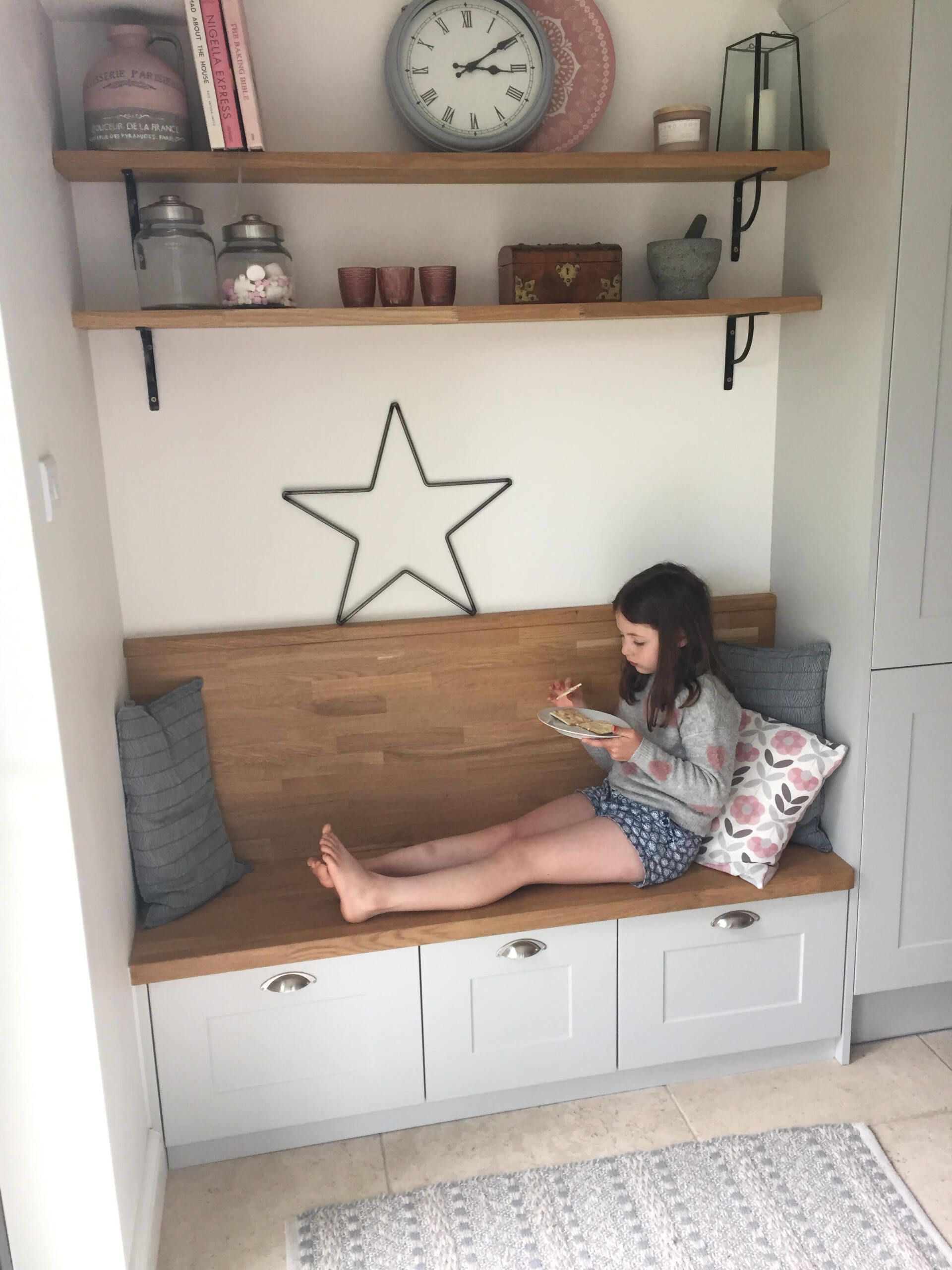 girl enjoying toast on wooden bench