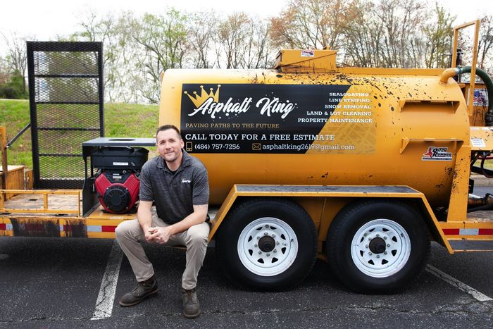 Staff Sitting on Business Truck — Wilmington, DE — Asphalt King Sealcoating & Paving LLC Staff Sitting on Business Truck — Wilmington, DE — Asphalt King Sealcoating & Paving LLC