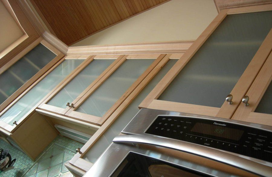 A kitchen with stainless steel appliances and wooden cabinets