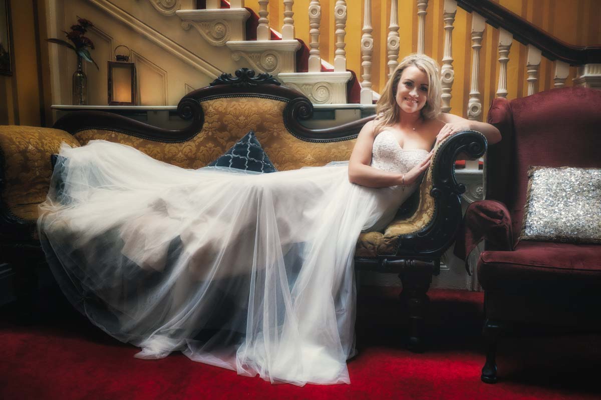 Fitzgeralds Vienna Woods wedding photos - bride laying on chair