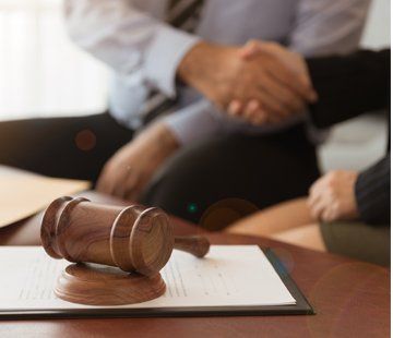 Sean Campbell Law Okemos — Judge Gavel With Lawyer Having Handshake in Okemos, MI Sean Campbell Law Okemos — Judge Gavel With Lawyer Having Handshake in Okemos, MI