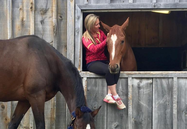 Ashley with two of her horses at Kings Meadow Equestrian Centre